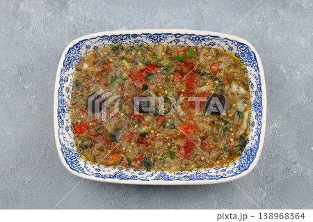 Traditional Turkish Roasted Eggplant Salad Meze with Garlic and Olive Oil on a Rustic Plate Backdrop 138968364