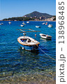 Vertical view of small boat floating on crystal clear sea water with visible seabed, Adriatic coast landscape, summer travel destination, peaceful marine scene 138968485
