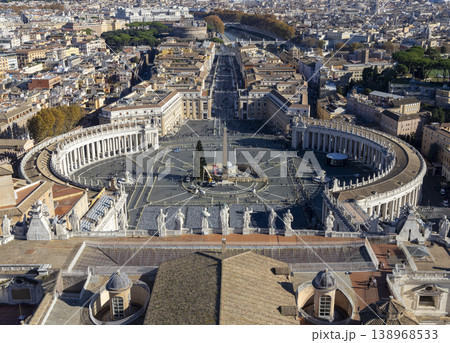 Panoramic view of Vatican City and Rome from St. Peter's Basilica dome offering an expansive. St. Peter's Square Rome panoramic cityscape. View from dome of St. Peters Basilica. Popular tourist place. Panoramic view of Vatican City and Rome from St. Peter's Basilica dome offering an expansive. St. Peter's Square Rome panoramic cityscape. View from dome of St. Peters Basilica. Popular tourist place. 138968533