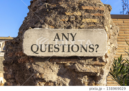 Any questions symbol. Concept words Any questions on beautiful big white sign plate. Beautiful old brown brick wall blue sky background. Business and Any questions Q and A concept, copy space. Any questions symbol. Concept words Any questions on beautiful big white sign plate. Beautiful old brown brick wall blue sky background. Business and Any questions Q and A concept, copy space. 138969029