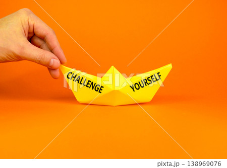 Challenge yourself words symbol. Concept words Challenge yourself on beautiful yellow paper boat. Beautiful orange background. Business lifestyle and Challenge yourself words concept. Copy space. 138969076