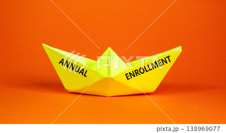 Annual enrollment words symbol. Concept words Annual enrollment on beautiful yellow paper boat. Beautiful orange background. Medical and Annual enrollment words concept. Copy space. 138969077
