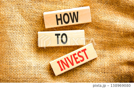How to invest words symbol. Concept words How to invest on beautiful wooden blocks. Beautiful canvas background. Business and how to invest concept. Copy space. 138969080