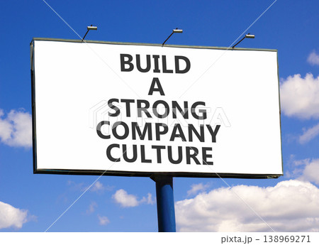 Strong company culture symbol. Concept words Build a strong company culture on beautiful white billboard. Beautiful blue sky background. Business strong company culture concept. Copy space. Strong company culture symbol. Concept words Build a strong company culture on beautiful white billboard. Beautiful blue sky background. Business strong company culture concept. Copy space. 138969271