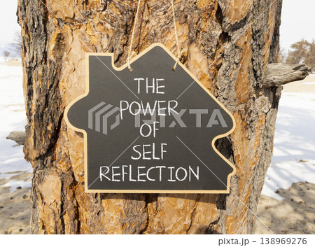 Self reflection symbol. Concept words The power of self reflection on beautiful black blackboard. Beautiful old pine tree background. Business the power of self reflection concept. Copy space. 138969276