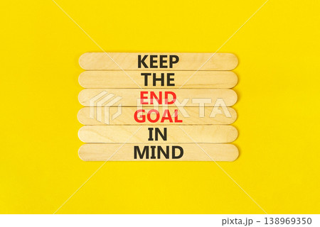 Keep the end goal in mind symbol. Concept words Keep the end goal in mind on beautiful wooden sticks. Beautiful yellow paper background. Business keep the end goal in mind concept. Copy space. Keep the end goal in mind symbol. Concept words Keep the end goal in mind on beautiful wooden sticks. Beautiful yellow paper background. Business keep the end goal in mind concept. Copy space. 138969350