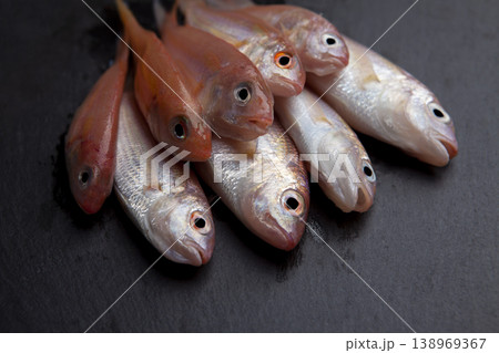 Fresh Red Coral Fish on Granite Surface 138969367