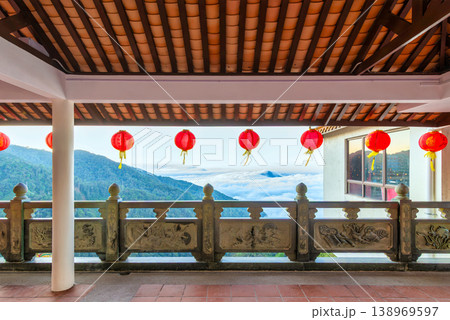 Red Chinese lanterns and carved railing at Chin Swee Caves Temple with sea of clouds view, Genting Highlands, Pahang, Malaysia Red Chinese lanterns and carved railing at Chin Swee Caves Temple with sea of clouds view, Genting Highlands, Pahang, Malaysia 138969597