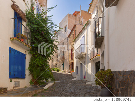 Narrow old street with white houses in Cadaques, Catalonia, Spain 138969745
