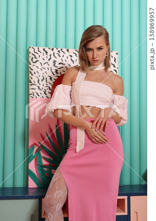 Full length woman in pink outfit studio pose for catalog Full length woman in pink outfit studio pose for catalog 138969957