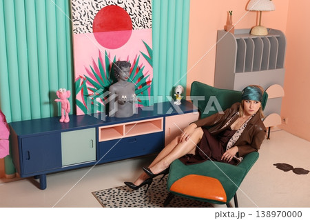 Artist seated comfortably amidst colorful studio ambiance 138970000