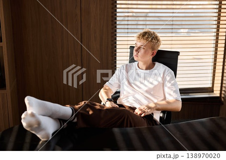 Serene image of man enjoying quiet moment before starting work session 138970020