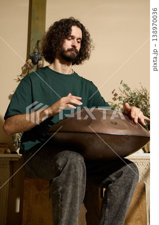 Bearded white handpan teacher filming tutorial session Bearded white handpan teacher filming tutorial session 138970036