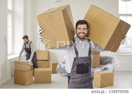 Portrait Of Smiling Mover With Boxes During Relocation 138970098