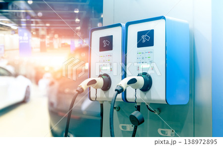 Electric car charging station for charge EV battery. Plug for vehicle with electric engine. EV charger station. Clean energy. Charging point for EV car. Green power. Future transport technology. Electric car charging station for charge EV battery. Plug for vehicle with electric engine. EV charger station. Clean energy. Charging point for EV car. Green power. Future transport technology. 138972895