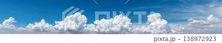 White fluffy clouds on blue sky. Soft touch feeling like cotton. White puffy clouds cape with space for text. Beauty in nature. Close-up white cumulus clouds texture background. Sky on sunny day. White fluffy clouds on blue sky. Soft touch feeling like cotton. White puffy clouds cape with space for text. Beauty in nature. Close-up white cumulus clouds texture background. Sky on sunny day. 138972923