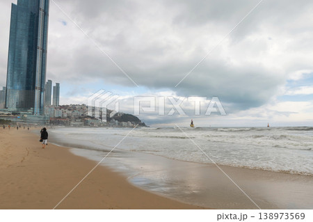 Korean people at Haeundae beach with modern high-rises, Busan 138973569