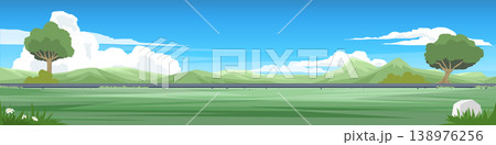 Landscape side view of a smooth asphalt road running parallel to a vast grassland. Trees flanking the left and right sides of free space meadow. Mountain with white clouds and blue sky background. 138976256