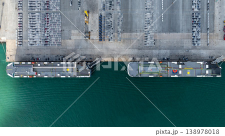 Aerial view cargo vehicles car carrier at import export cars terminal seaport, Vehicle car carrier vessel loading cars for shipping to worldwide, Automotive industry distribution logistic transport Aerial view cargo vehicles car carrier at import export cars terminal seaport, Vehicle car carrier vessel loading cars for shipping to worldwide, Automotive industry distribution logistic transport 138978018