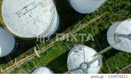 Aerial view white oil storage tank, White oil tank storage chemical petroleum petrochemical refinery product, white Industrial oil tanks. Business fuel and energy. 138978021