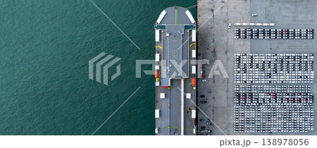 Aerial view cargo vehicles car carrier at import export cars terminal seaport, Vehicle car carrier vessel loading cars for shipping to worldwide, Automotive industry distribution logistic transport 138978056