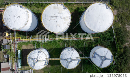 Aerial view white oil storage tank, White oil tank storage chemical petroleum petrochemical refinery product, white Industrial oil tanks. Business fuel and energy. 138978058