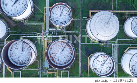 Aerial view white oil storage tank with pipeline steel, Crude oil industry, Storage fuel gas container tank petroleum refinery industrial factory, Oil storage chemical petrochemical refinery product. 138978129