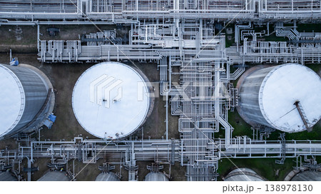Aerial view white oil storage tank with pipeline steel, Crude oil industry, Storage fuel gas container tank petroleum refinery industrial factory, Oil storage chemical petrochemical refinery product. Aerial view white oil storage tank with pipeline steel, Crude oil industry, Storage fuel gas container tank petroleum refinery industrial factory, Oil storage chemical petrochemical refinery product. 138978130