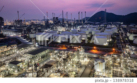 Aerial view Oil and Gas refinery plant at night, Global business energy logistic transportation, Oil and gas refinery petrochemical industrial, Petrochemical refinery industrial energy supply chain. Aerial view Oil and Gas refinery plant at night, Global business energy logistic transportation, Oil and gas refinery petrochemical industrial, Petrochemical refinery industrial energy supply chain. 138978318