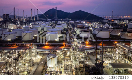 Aerial view Oil and Gas refinery plant at night, Global business energy logistic transportation, Oil and gas refinery petrochemical industrial, Petrochemical refinery industrial energy supply chain. Aerial view Oil and Gas refinery plant at night, Global business energy logistic transportation, Oil and gas refinery petrochemical industrial, Petrochemical refinery industrial energy supply chain. 138978319