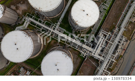 Aerial view oil and gas refinery petrochemical storage tank and pipeline steel, Oil and gas transportation system pipeline steel at oil and gas refinery industry chemical plant, Pipeline oil and gas. Aerial view oil and gas refinery petrochemical storage tank and pipeline steel, Oil and gas transportation system pipeline steel at oil and gas refinery industry chemical plant, Pipeline oil and gas. 138978334