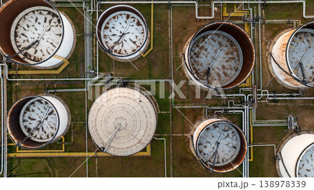 Aerial view oil and gas refinery petrochemical storage tank and pipeline steel, Oil and gas transportation system pipeline steel at oil and gas refinery industry chemical plant, Pipeline oil and gas. Aerial view oil and gas refinery petrochemical storage tank and pipeline steel, Oil and gas transportation system pipeline steel at oil and gas refinery industry chemical plant, Pipeline oil and gas. 138978339