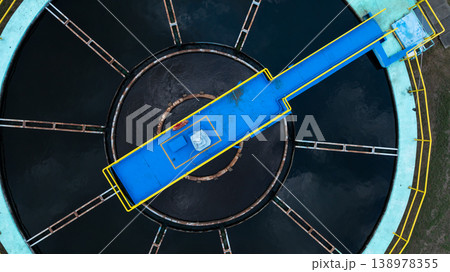 Aerial view circular clarifier tank at watewater treatment plant, Industrial infrastucture, Environment technology sustainable water management system, Semimentation tank circular clarifier. Aerial view circular clarifier tank at watewater treatment plant, Industrial infrastucture, Environment technology sustainable water management system, Semimentation tank circular clarifier. 138978355