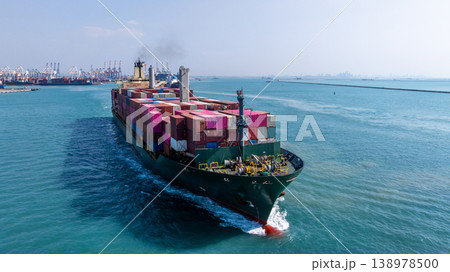 Aerial view container cargo ship carrying container in import export business logistic and transportation of international by container cargo ship, Container cargo ship freight shipping supply chain Aerial view container cargo ship carrying container in import export business logistic and transportation of international by container cargo ship, Container cargo ship freight shipping supply chain 138978500