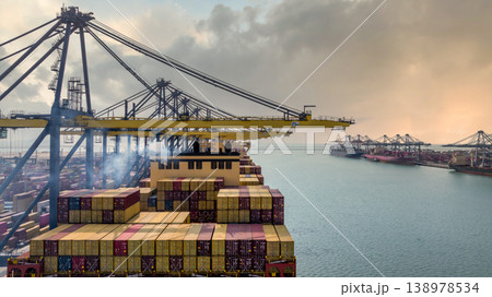 Aerial view Container cargo ship loading unloading container import export sea port, Global trade business container cargo ship freight shipping commercial trade logistic transportation international. Aerial view Container cargo ship loading unloading container import export sea port, Global trade business container cargo ship freight shipping commercial trade logistic transportation international. 138978534