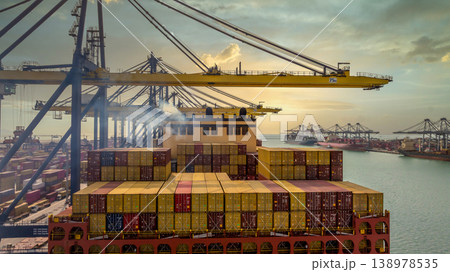 Aerial view Container cargo ship loading unloading container import export sea port, Global trade business container cargo ship freight shipping commercial trade logistic transportation international. Aerial view Container cargo ship loading unloading container import export sea port, Global trade business container cargo ship freight shipping commercial trade logistic transportation international. 138978535
