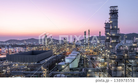 Aerial view oil and gas petrochemical storage tank with oil and gas refinery plant at twilight, Global business power and energy petrochemical industry, Oil and gas refinery petrochemical industrial. 138978558