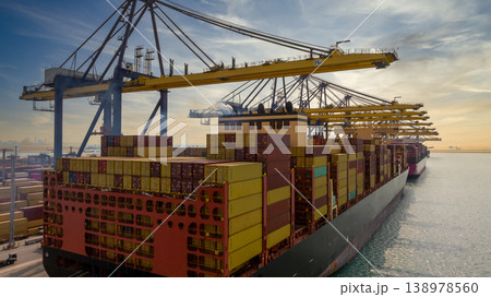 Aerial view Container cargo ship loading unloading container import export sea port, Global trade business container cargo ship freight shipping commercial trade logistic transportation international. Aerial view Container cargo ship loading unloading container import export sea port, Global trade business container cargo ship freight shipping commercial trade logistic transportation international. 138978560