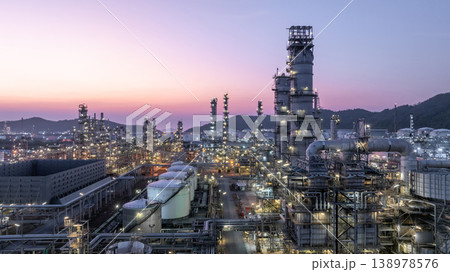 Aerial view oil and gas petrochemical storage tank with oil and gas refinery plant at twilight, Global business power and energy petrochemical industry, Oil and gas refinery petrochemical industrial. 138978576