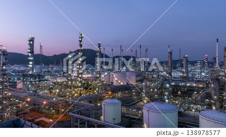 Aerial view oil and gas petrochemical storage tank with oil and gas refinery plant at twilight, Global business power and energy petrochemical industry, Oil and gas refinery petrochemical industrial. 138978577