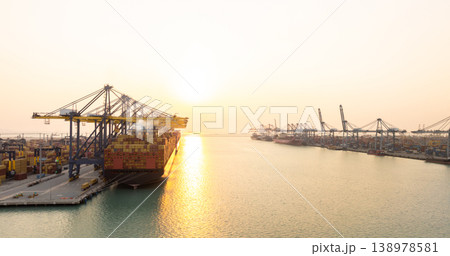 Aerial view Container cargo ship loading unloading container import export sea port, Global trade business container cargo ship freight shipping commercial trade logistic transportation international. Aerial view Container cargo ship loading unloading container import export sea port, Global trade business container cargo ship freight shipping commercial trade logistic transportation international. 138978581