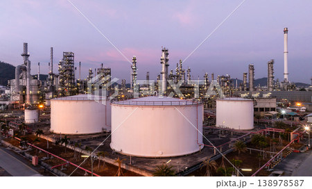 Aerial view oil and gas petrochemical storage tank with oil and gas refinery plant at twilight, Global business power and energy petrochemical industry, Oil and gas refinery petrochemical industrial. 138978587