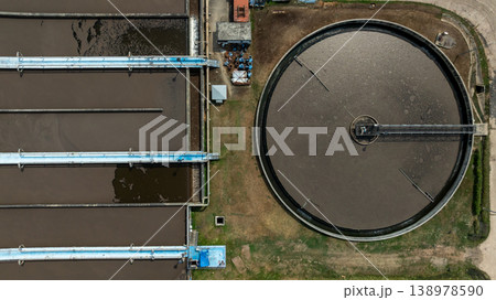 Aerial view wastewater treatment plant. Circular sedimentation tanks biological reactor, Water cleaning facility wastewater treatment plant, Recirculation solid contact clarifier sedimentation tank. Aerial view wastewater treatment plant. Circular sedimentation tanks biological reactor, Water cleaning facility wastewater treatment plant, Recirculation solid contact clarifier sedimentation tank. 138978590
