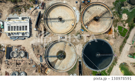 Aerial view wastewater treatment plant. Circular sedimentation tanks biological reactor, Water cleaning facility wastewater treatment plant, Recirculation solid contact clarifier sedimentation tank. Aerial view wastewater treatment plant. Circular sedimentation tanks biological reactor, Water cleaning facility wastewater treatment plant, Recirculation solid contact clarifier sedimentation tank. 138978591