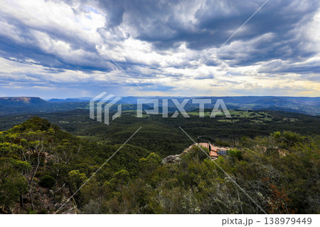 Aerial view over Hargraves Lookout in the Blue Mountains, New South Wales, Australia. The scenic landscape shows dramatic sandstone cliffs, deep valleys and forest covered wilderness Aerial view over Hargraves Lookout in the Blue Mountains, New South Wales, Australia. The scenic landscape shows dramatic sandstone cliffs, deep valleys and forest covered wilderness 138979449