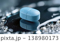 Blue Medical Tablet on Reflective Surface 138980173