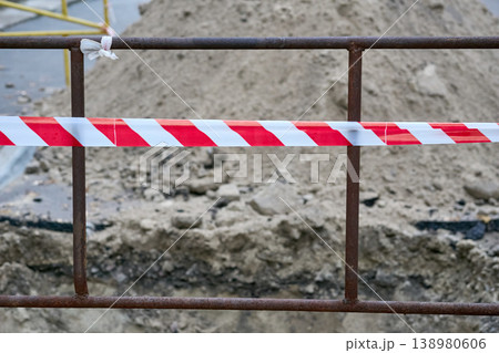 Red white tape,fencing reiling warning of danger during construction,repairs 138980606