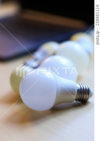 LED Light Bulbs on Wooden Table with Soft Focus Background LED Light Bulbs on Wooden Table with Soft Focus Background 138981114