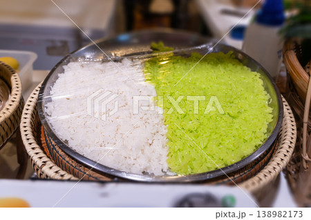 Sweet sticky rice or khao niao, which is the base for many popular Thai desserts. The food court features preparations for dishes such as Khao Niao Mamuang rice with mango or rice with Thai custard Sweet sticky rice or khao niao, which is the base for many popular Thai desserts. The food court features preparations for dishes such as Khao Niao Mamuang rice with mango or rice with Thai custard 138982173