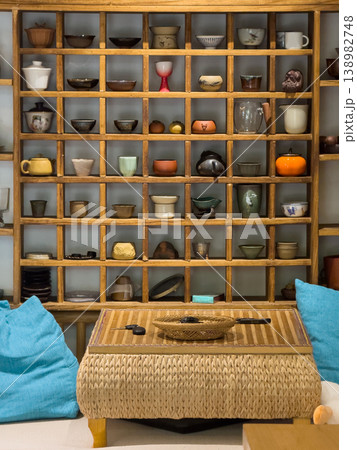 collection of tea ceremony items placed on a wooden shelf collection of tea ceremony items placed on a wooden shelf 138982748